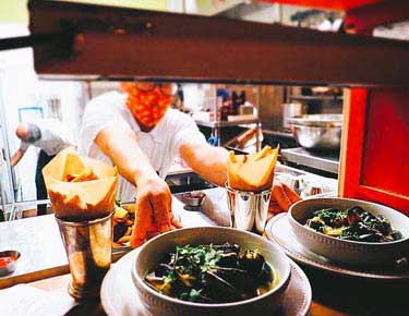 Chef putting food on plate